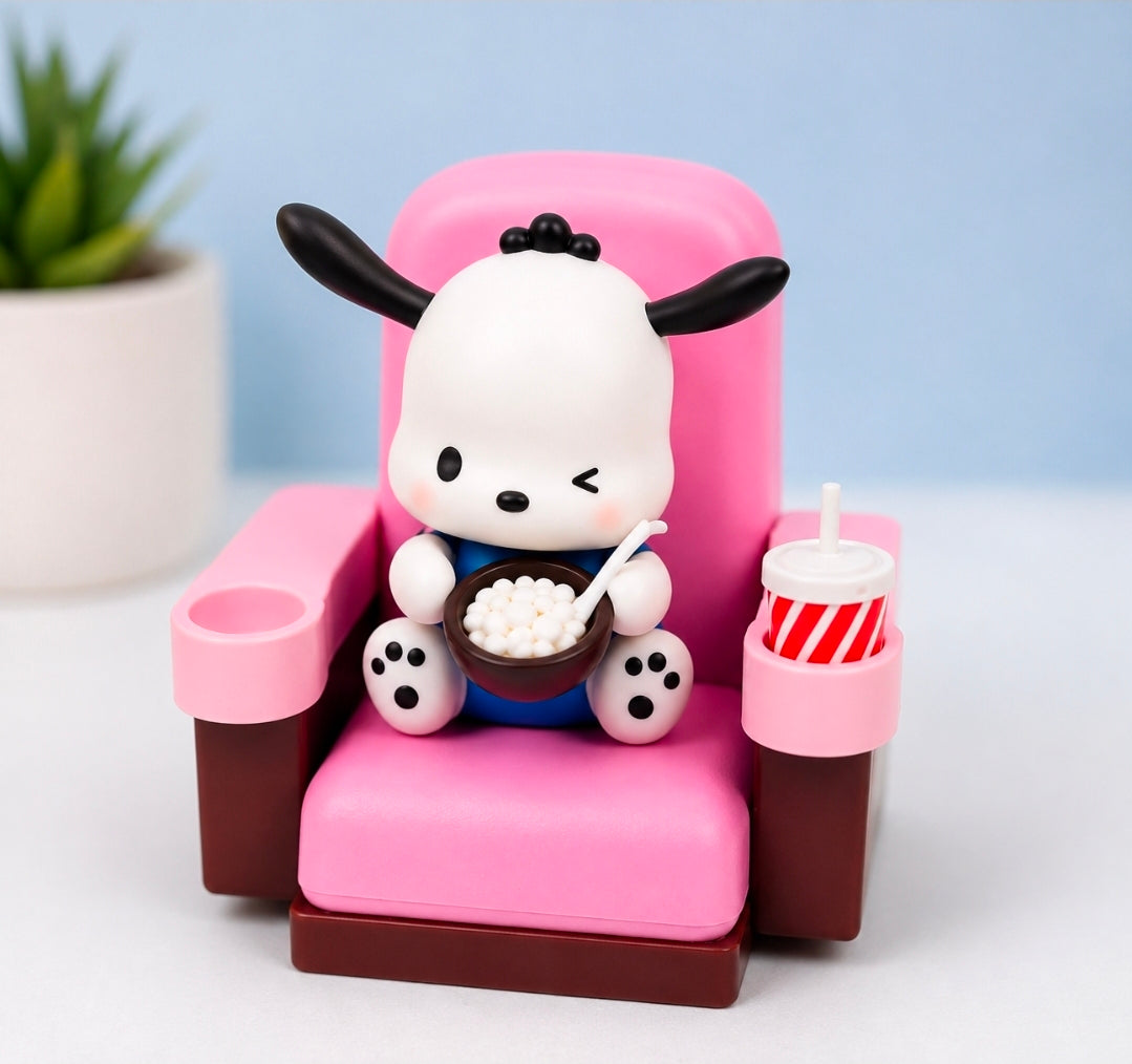Mini character figure in a pink theater chair holding a bowl of food