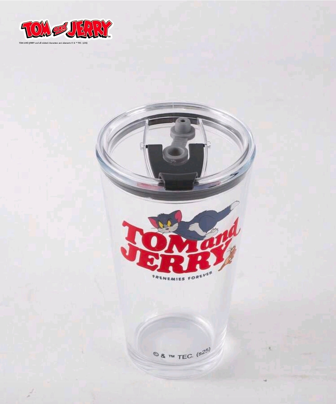 Clear tumbler with black straw lid and Tom and Jerry graphic