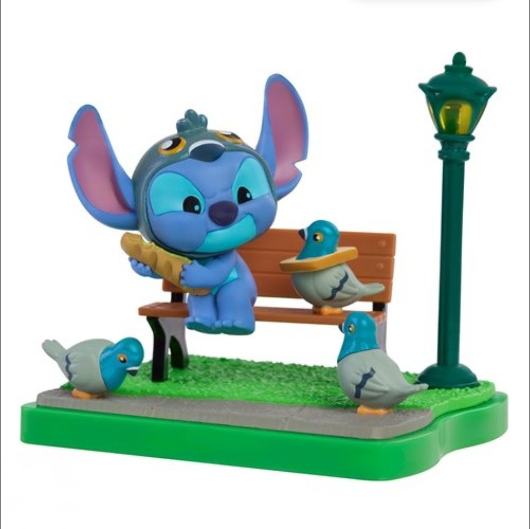 Stitch blind box figure on green grass base with wooden bench, gray bird, and streetlamp