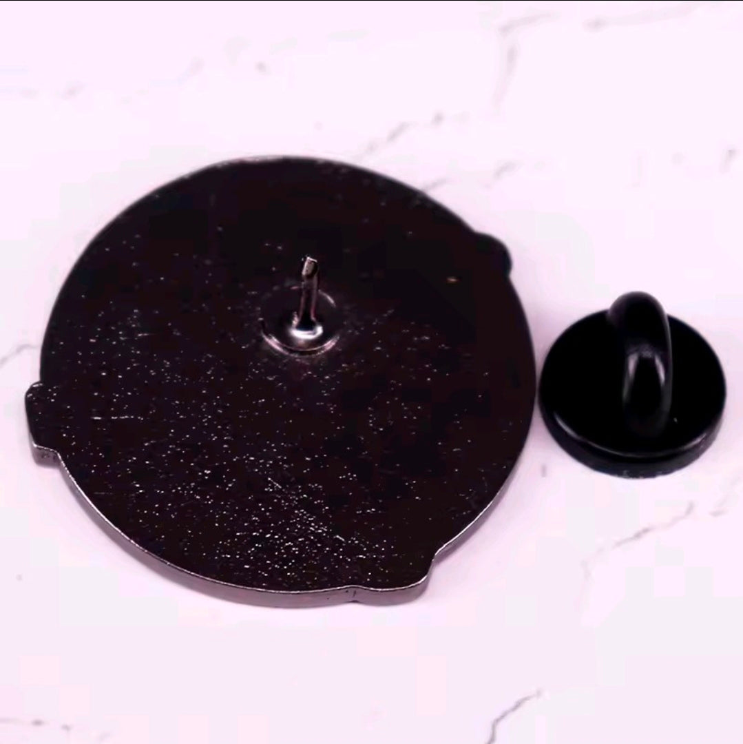 Black enamel pin back with safety pin post and matching black clutch