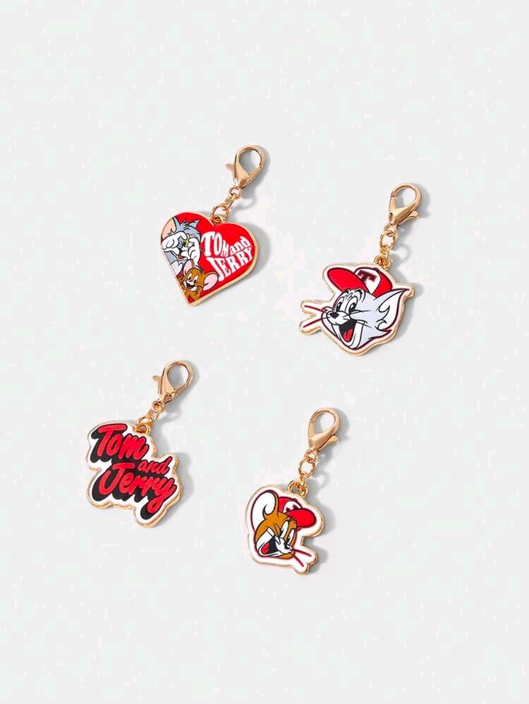 Set of 4 Tom & Jerry enamel bag charms in heart and character shapes, gold-tone hooks