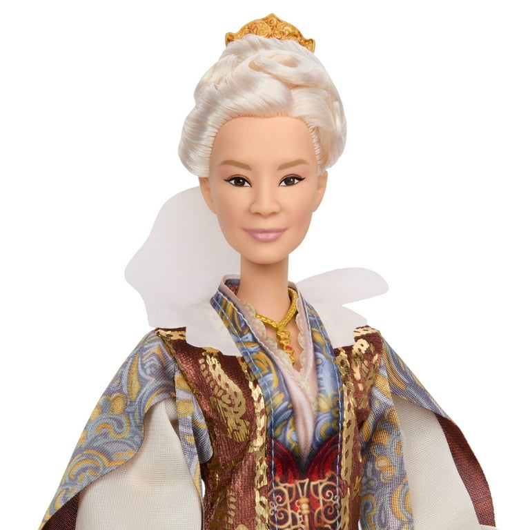 Fashion doll close-up with white updo hairstyle and ornate maroon-and-blue garment neckline.