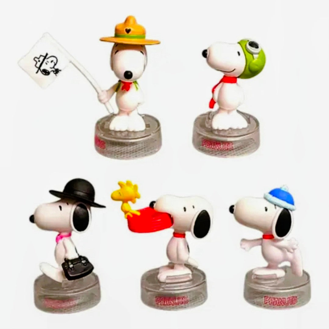 Complete set of five Snoopy mini figures with accessories, standing on clear round bases