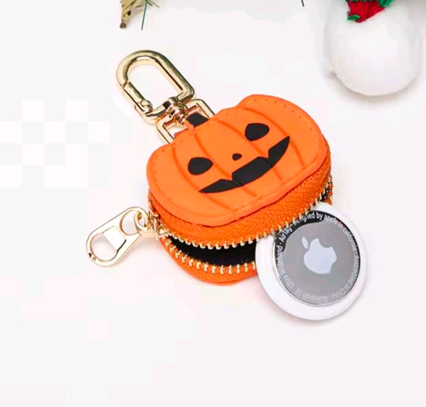 Orange jack-o-lantern mini coin purse keychain with gold clasp and zip top