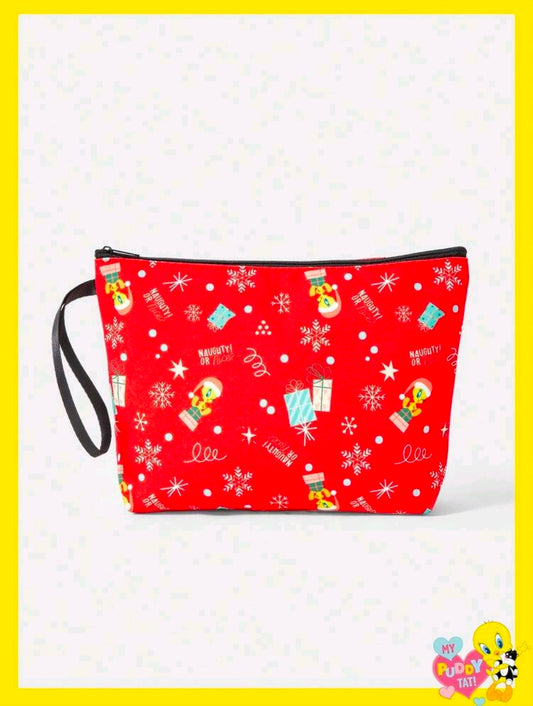 Red holiday makeup bag with zipper top, black strap, and festive Christmas character pattern