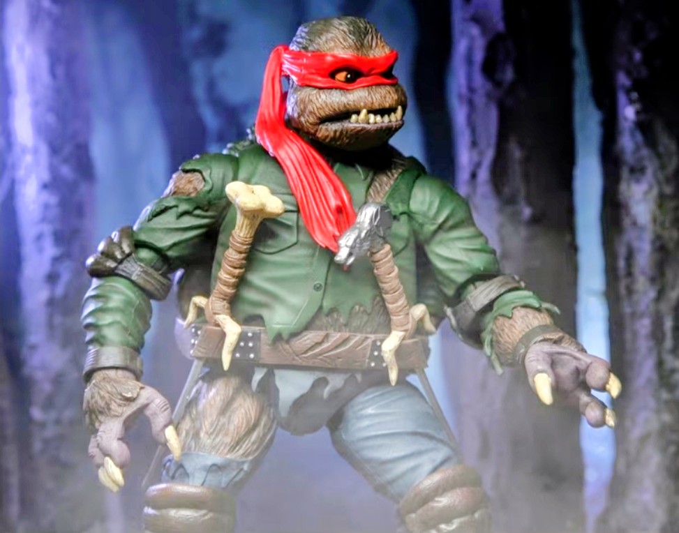 Raphael as Wolf Man figure standing, red hair and mask, green shirt, brown belt and vest