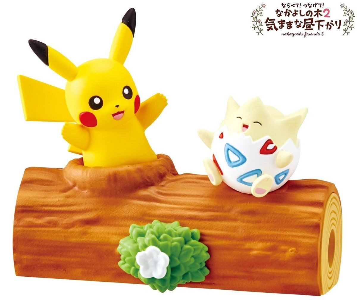 Pikachu and Togepi mini figures on a brown log display with green plant detail