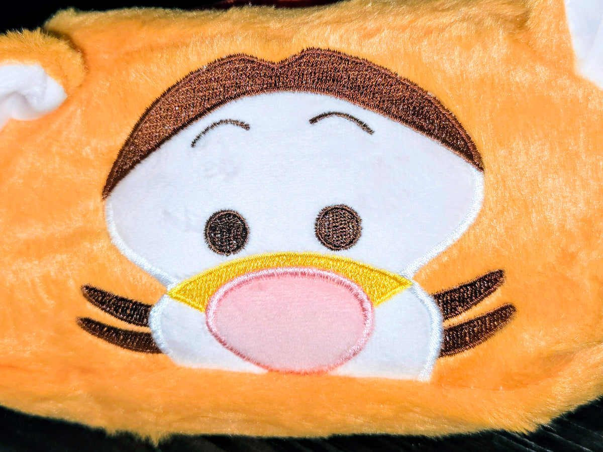 Tigger plush zipper pouch face close-up with white muzzle and embroidered eyes