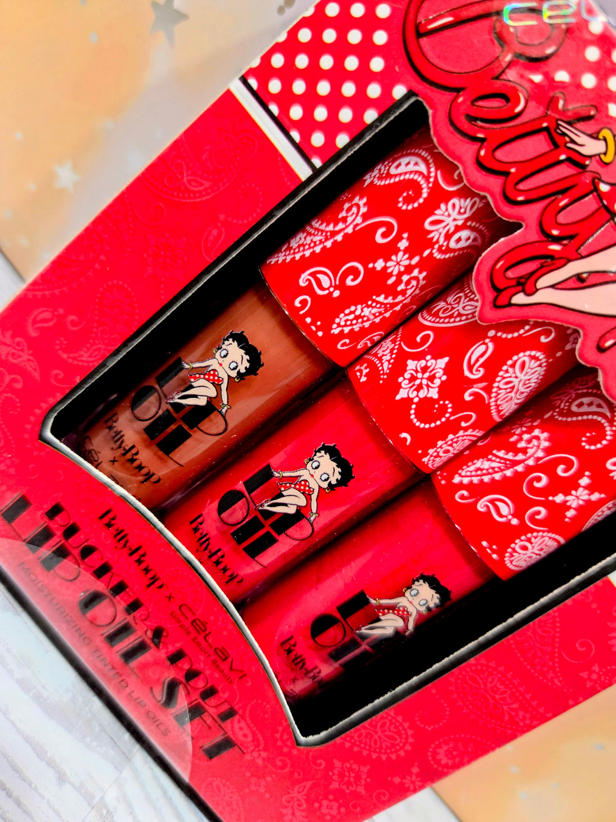 Celavi Betty Boop tinted lip oil set, red tubes with cartoon Betty Boop prints