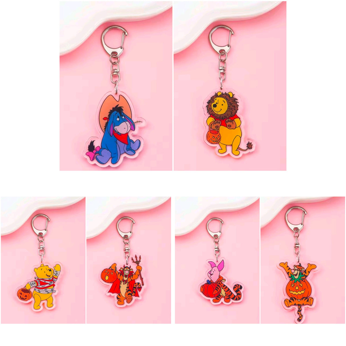 Acrylic Halloween keychains with carabiners; two separate character charms with jack-o-lantern details.