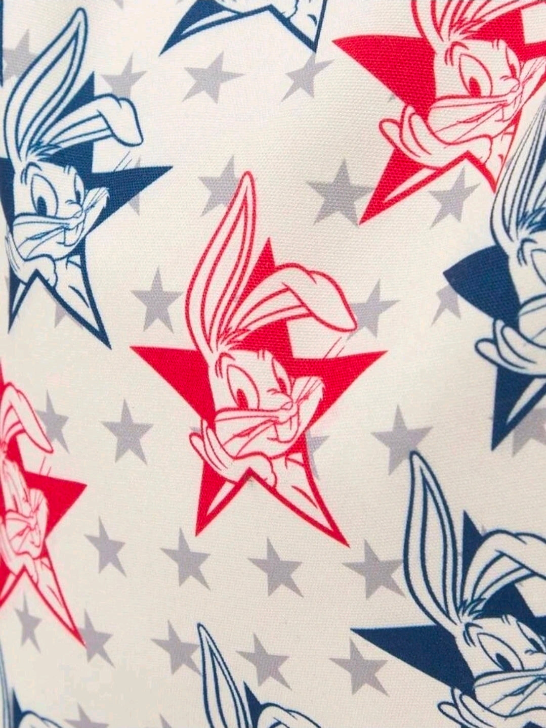 Printed tote fabric with stars and cartoon bunny faces in red, white, and blue