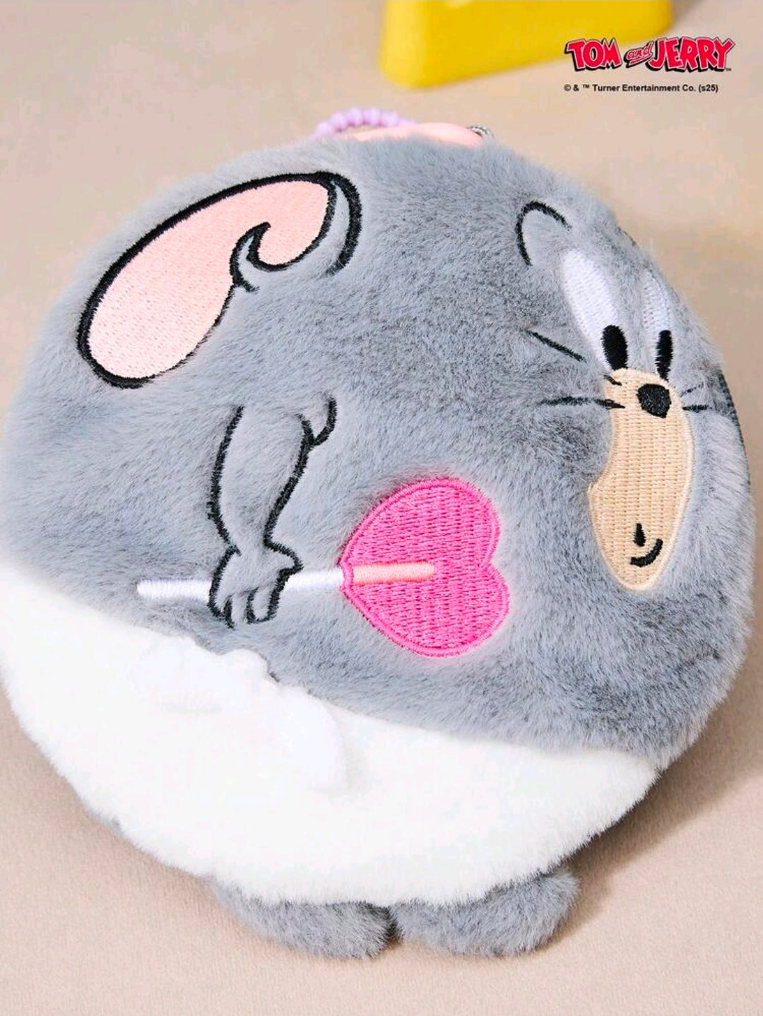 Grey round plush keychain bag charm with Tom-like cat face and pink heart