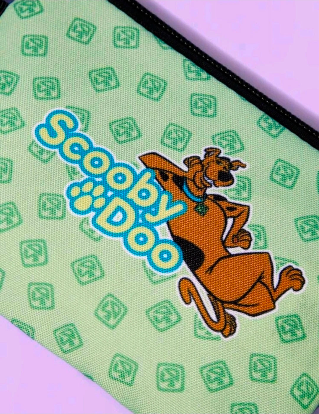 Green Scooby-Doo makeup pouch with black zipper and Scooby graphic pattern