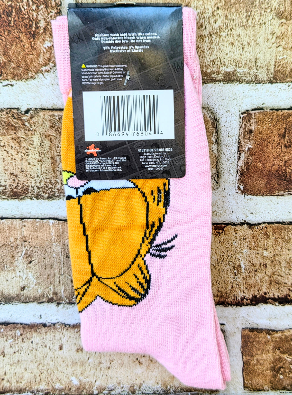 Pink Garfield socks with large cat character graphic and heel-to-toe knit detail.