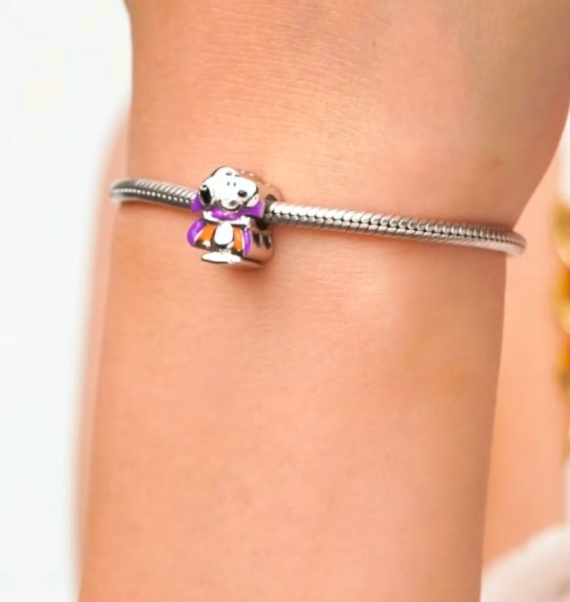 Silver snake bracelet with Snoopy vampire charm bead in purple and orange