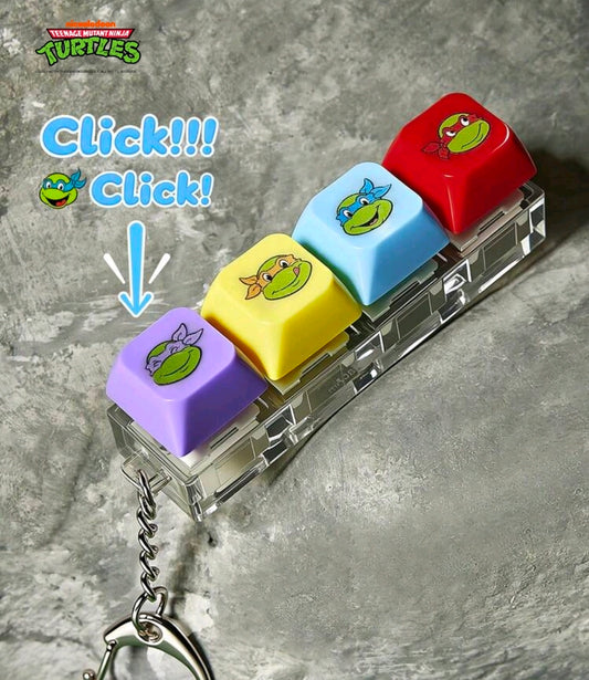 TMNT keyboard clicker keychain with chain, four keycaps, and turtle face designs