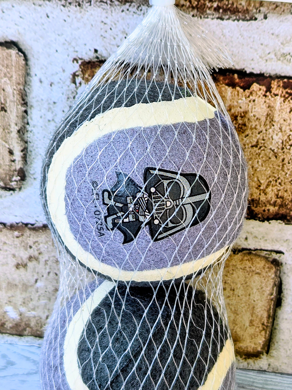 Star Wars mesh pet ball with Darth Vader print and yellow edge trim, two-tone gray.