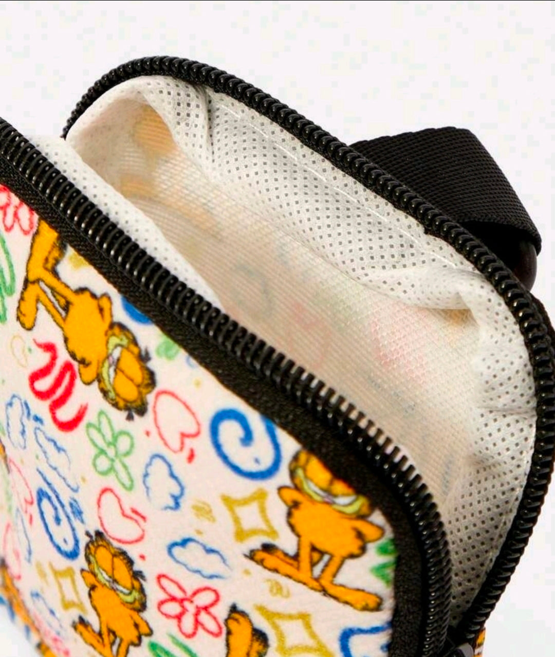 Zippered coin pouch with black trim and multicolor Garfield doodle print interior lining