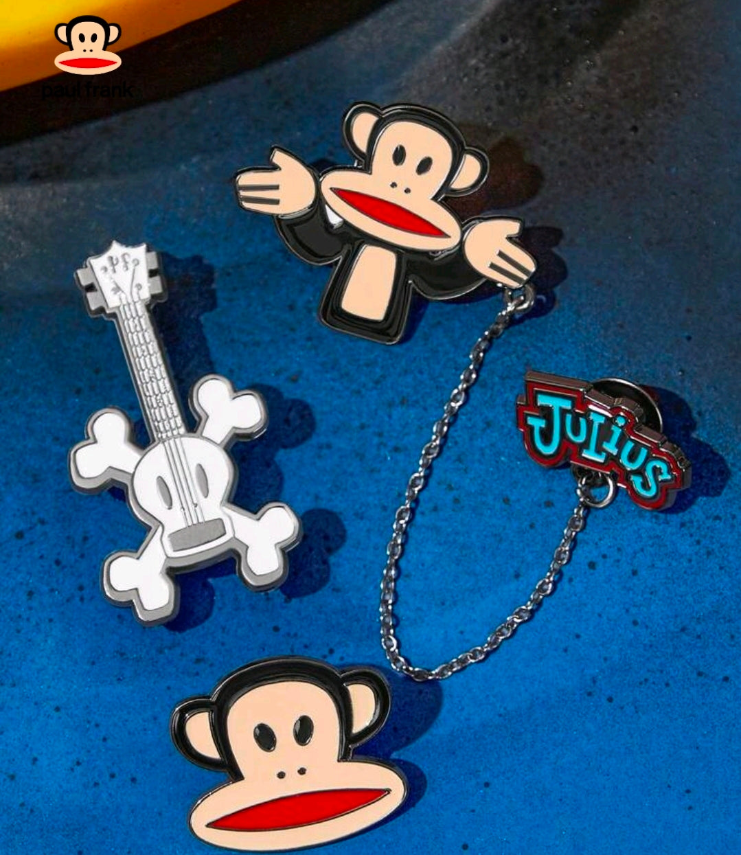 3-piece enamel pin set with Julius monkey face, guitar, and Tutius logo pins