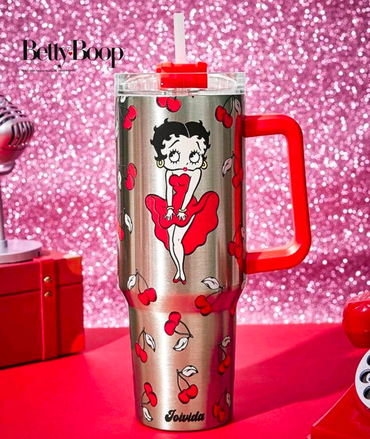 Stainless steel tumbler with Betty Boop character, cherry print, red handle and clear straw lid.