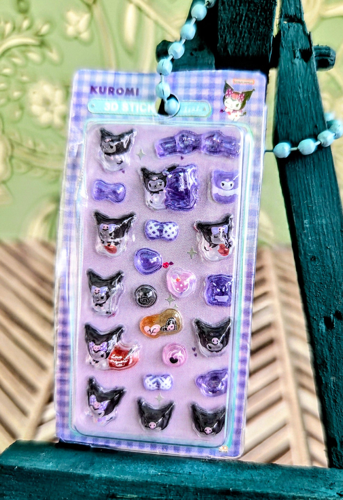 Kuromi 3D sticker keychain set card with clear blister and mixed purple and small round charms.