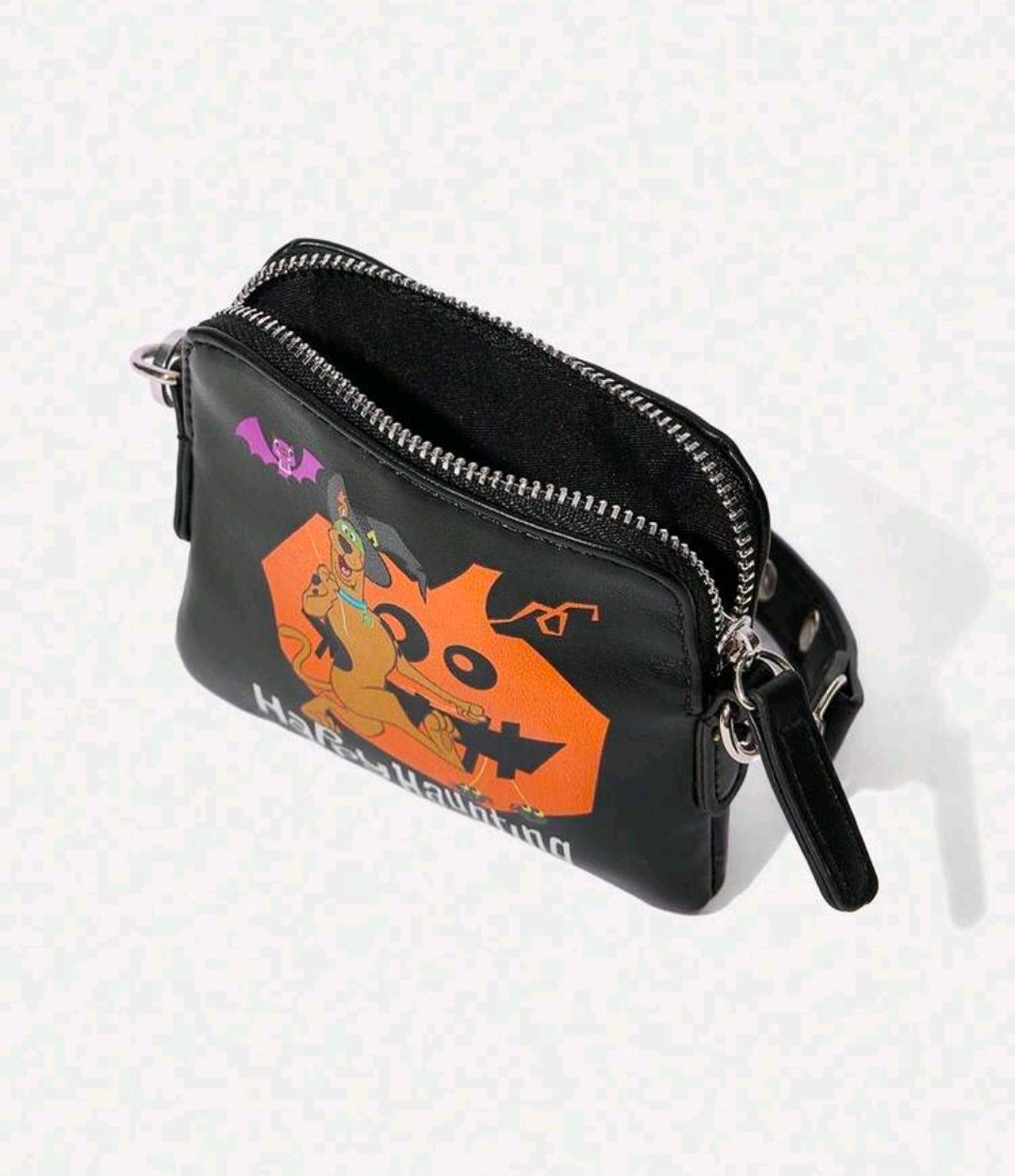 Black zippered crossbody clutch with chain strap and Happy Haunting side graphic