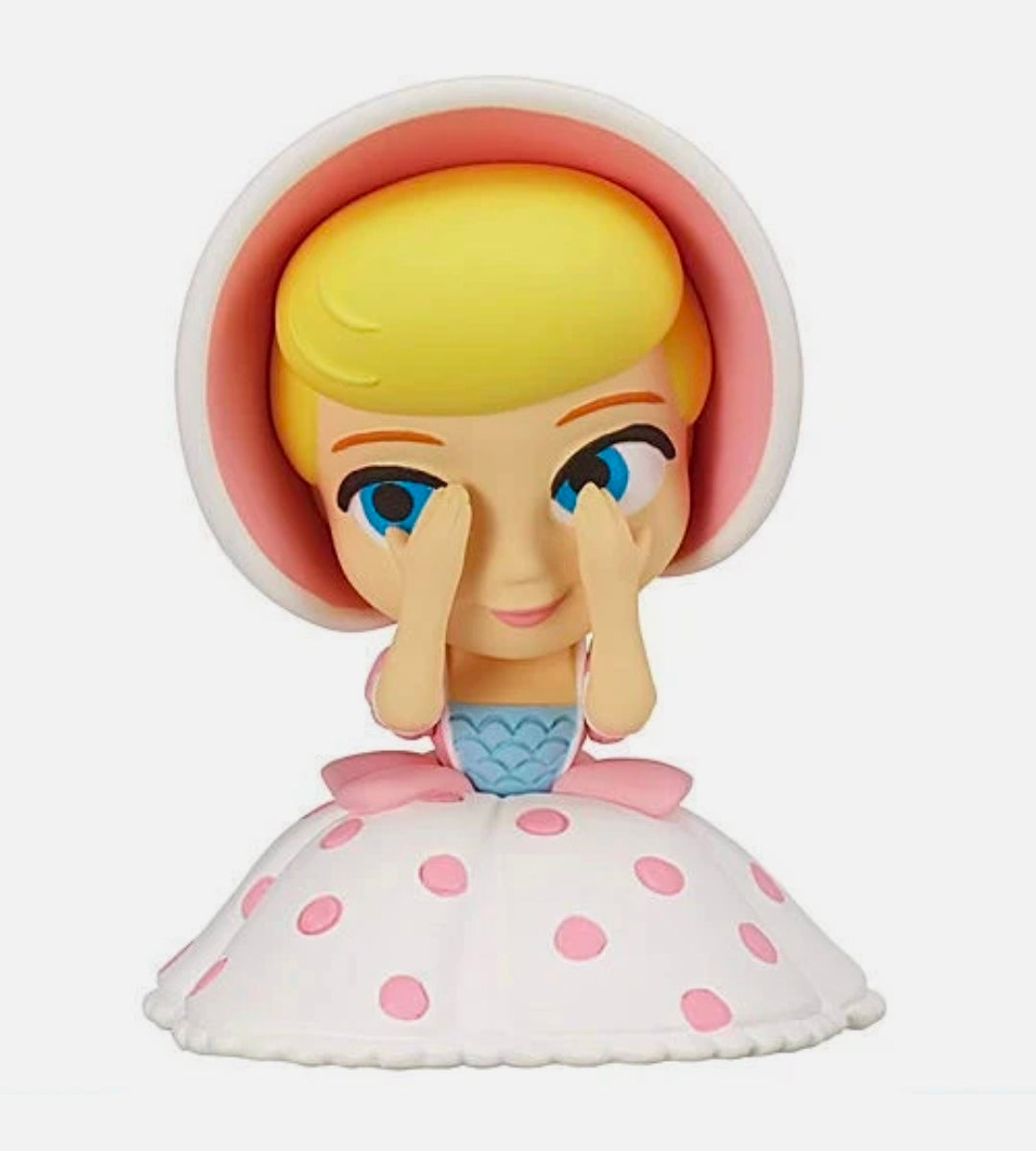 Girl gashapon figure with blue eyes, pink hood, and white dress with pink dots