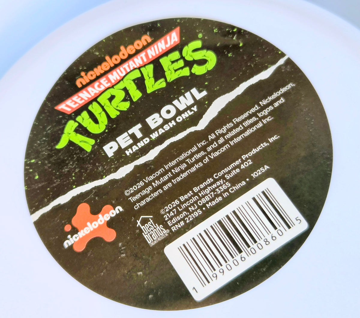 Black circular frisbee insert label with Teenaged Mutant Ninja Turtles text and barcode
