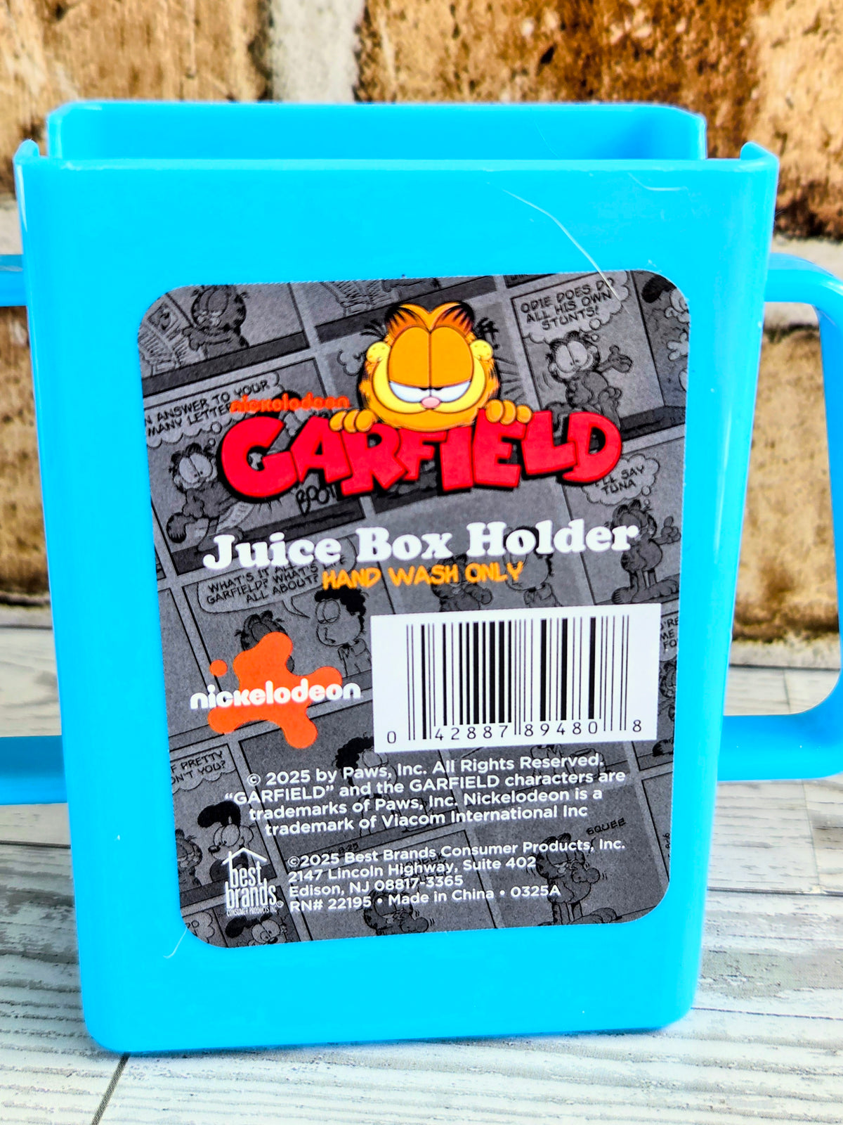 Blue Garfield juice box holder with handle and character graphics on front