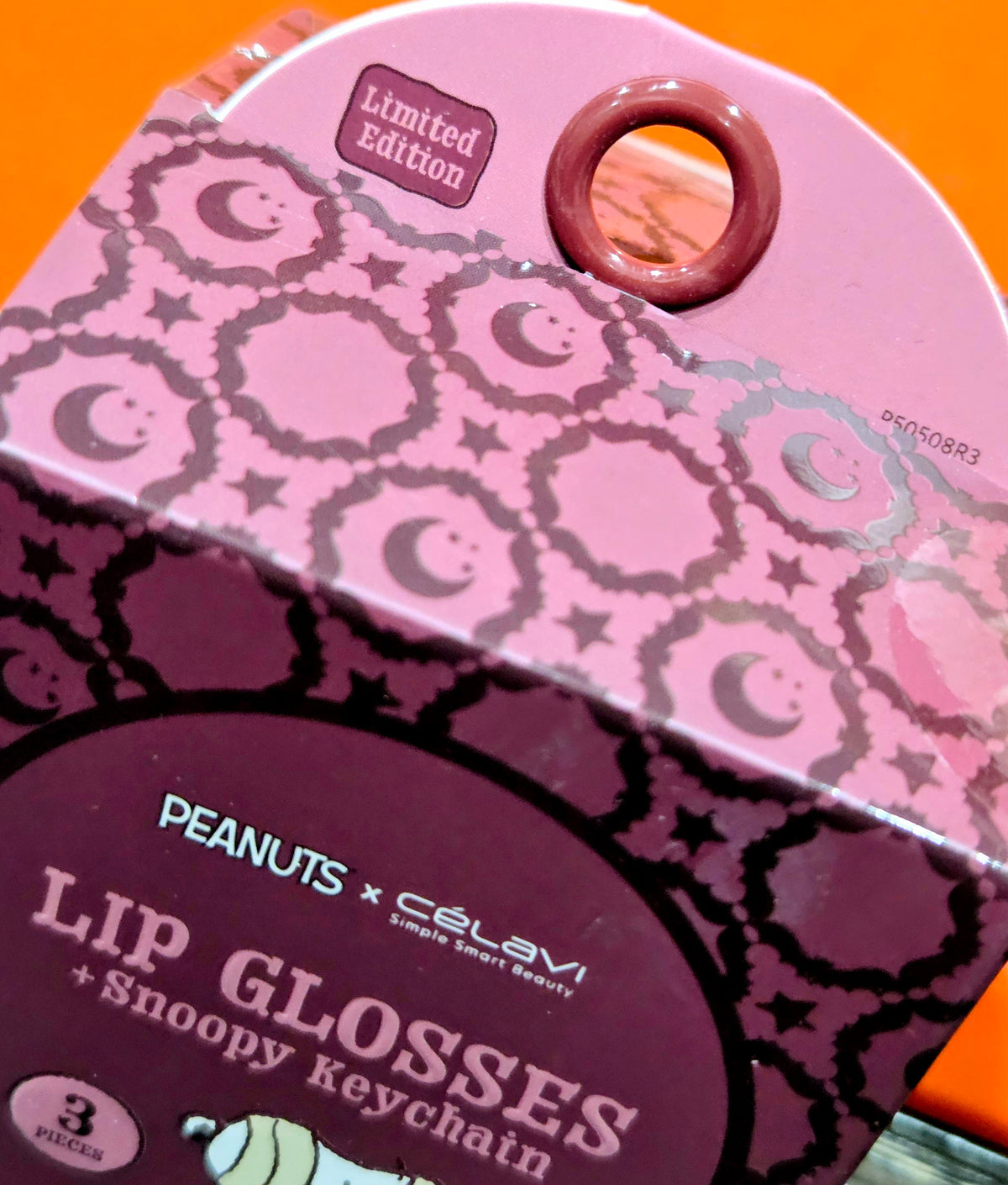 Limited edition Snoopy lip gloss lid with keychain tag artwork