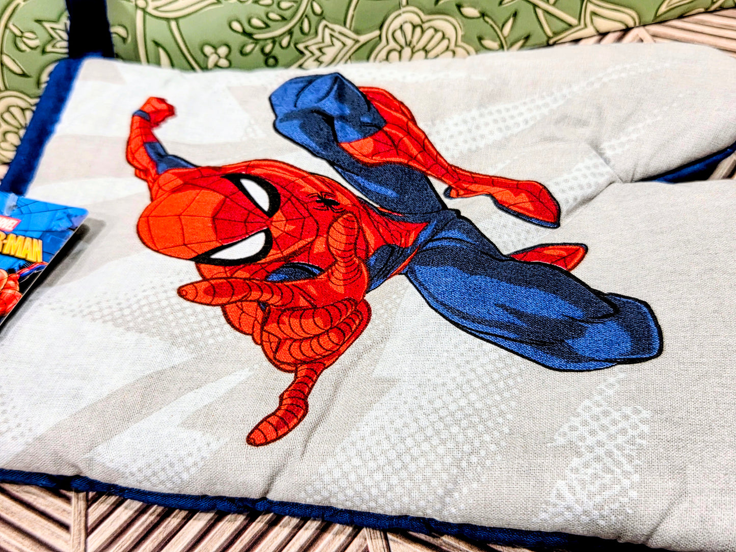 Spider-Man oven mitt close-up with large red-and-blue character graphic