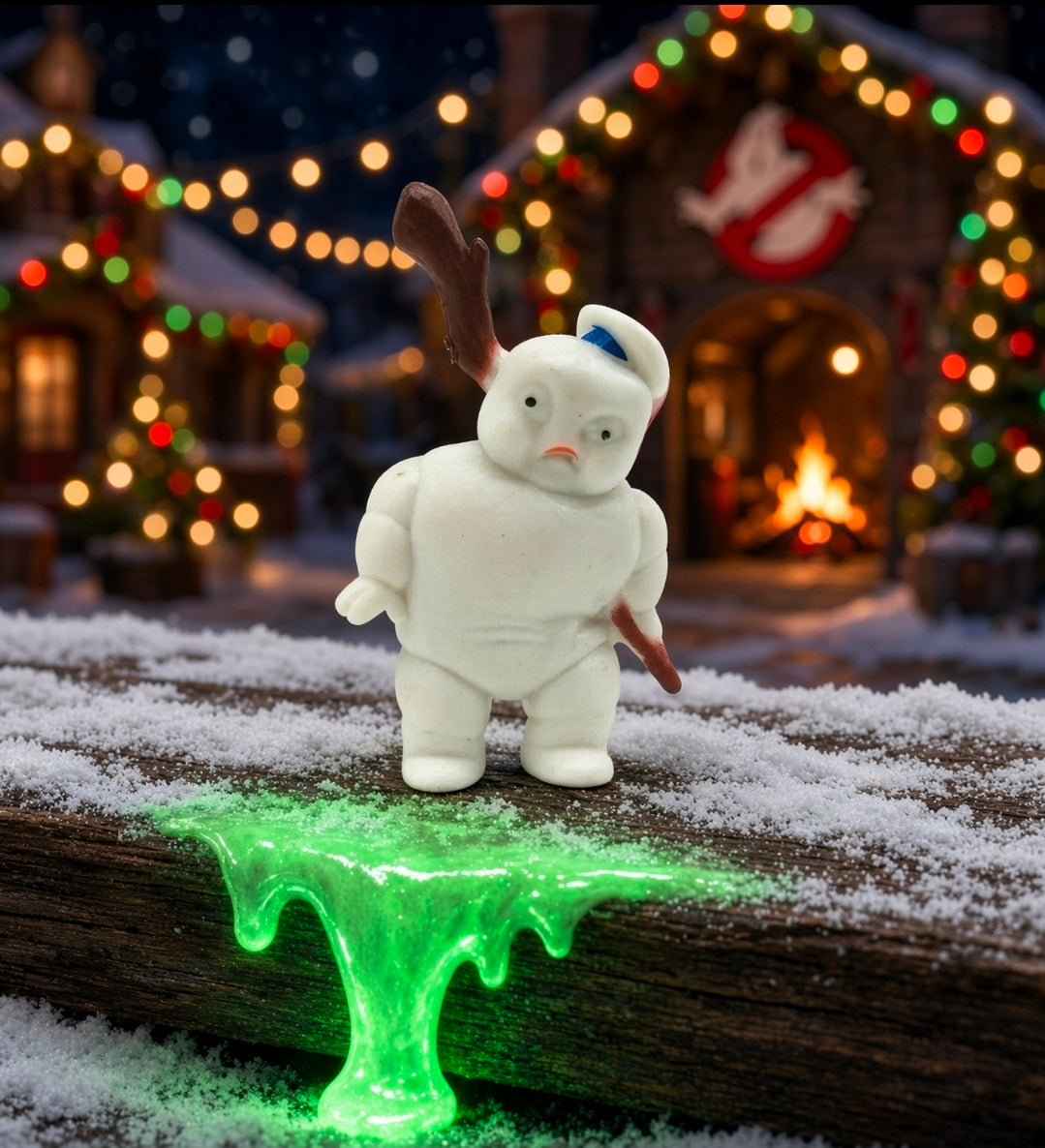 White Mini-Puft figure with raised arm, standing on snowy base with glowing green slime