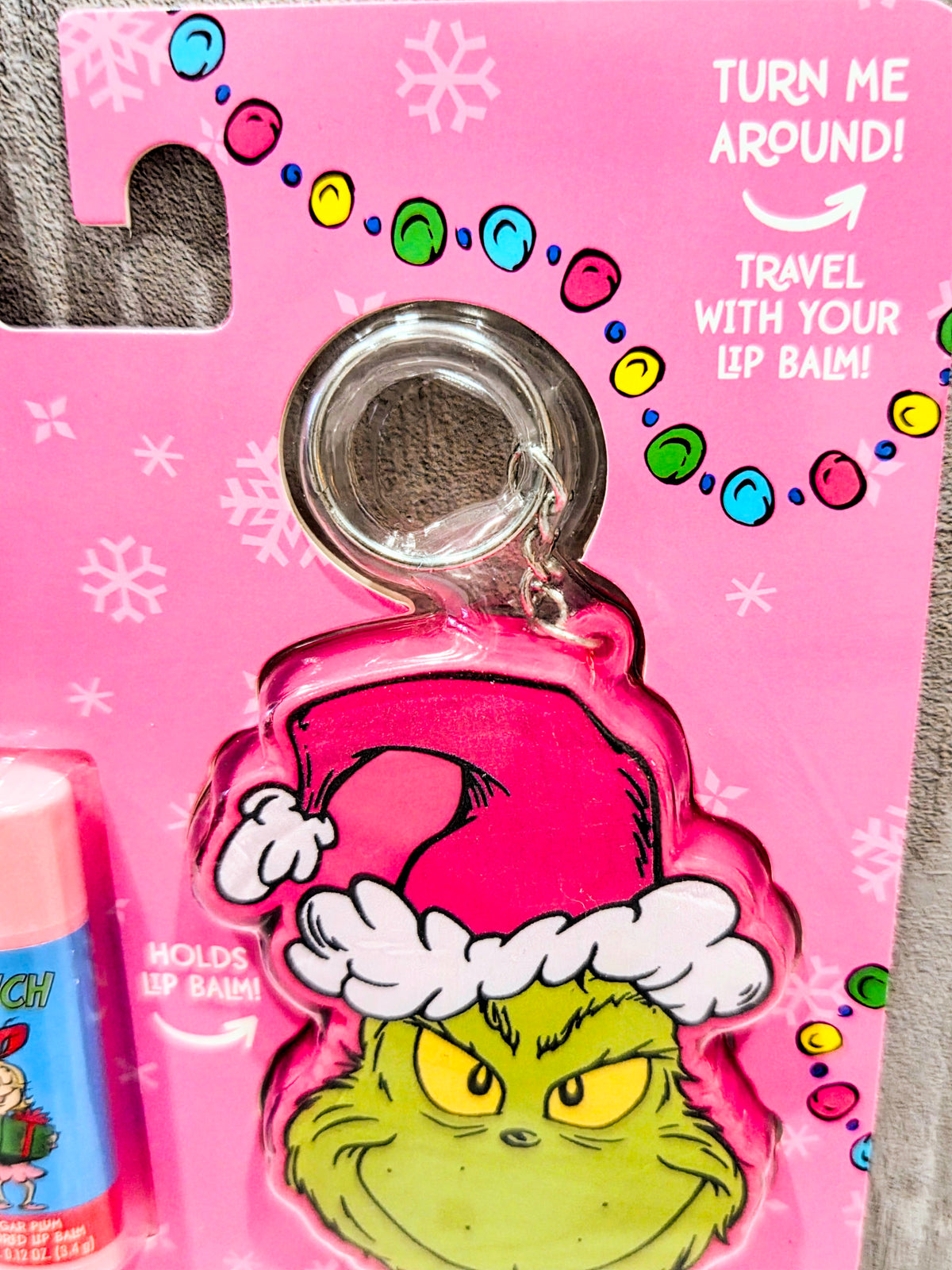 Pink Grinch keychain holder charm on flavored lip balm set card