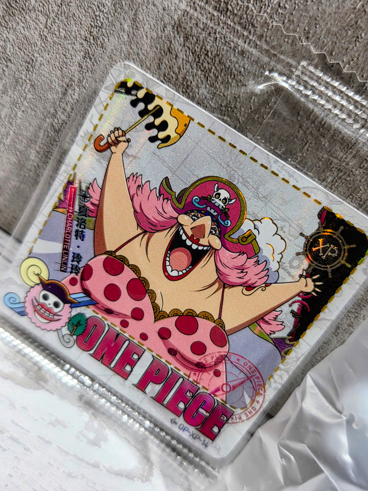 Collectible card pack with colorful character artwork and pink-haired figure