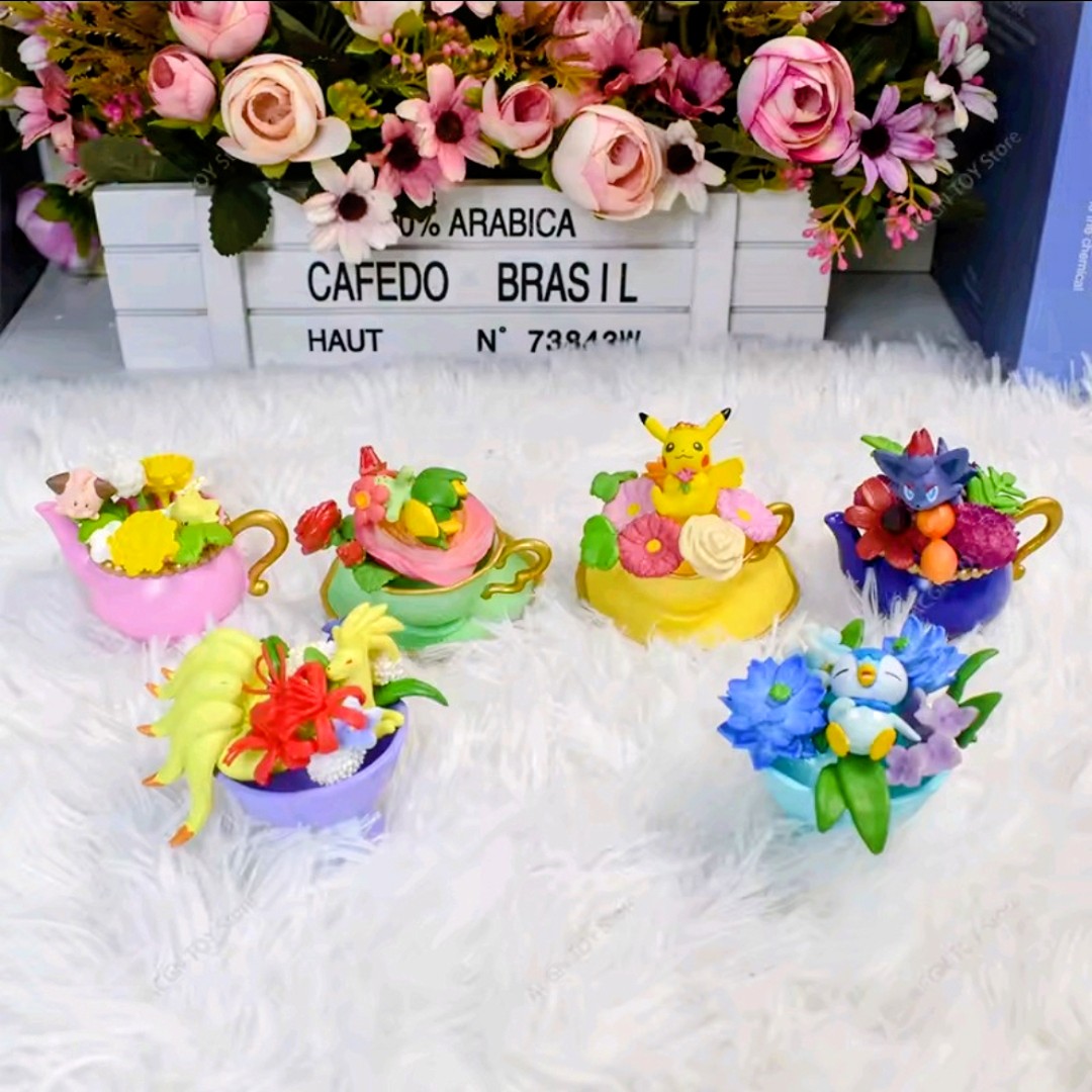 Assorted Floral Cup Collection mini figure teacups arranged on fluffy white display