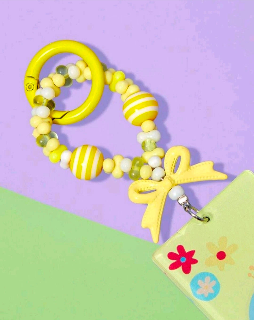 Snack-King keychain with yellow star charm and beads attached to pouch