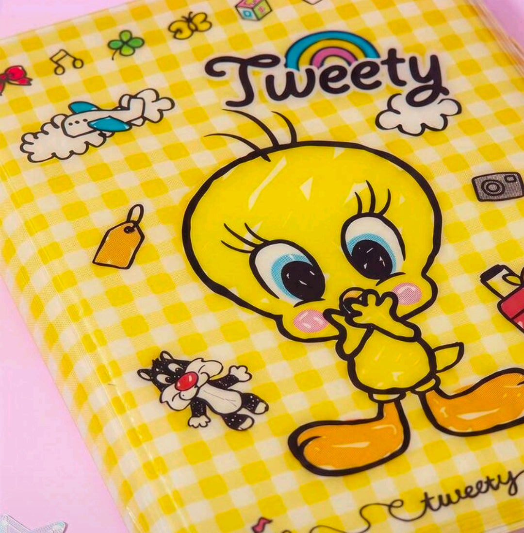 Yellow check-pattern Tweety bird sticker binder cover, close-up