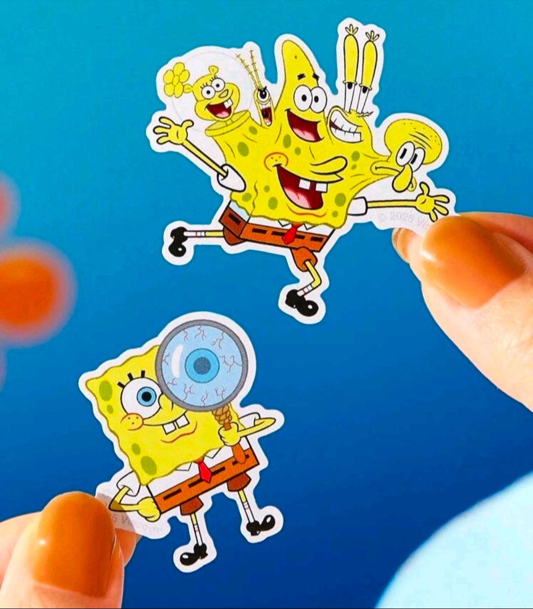 Undersea character sticker sheet with two chibi figures being placed