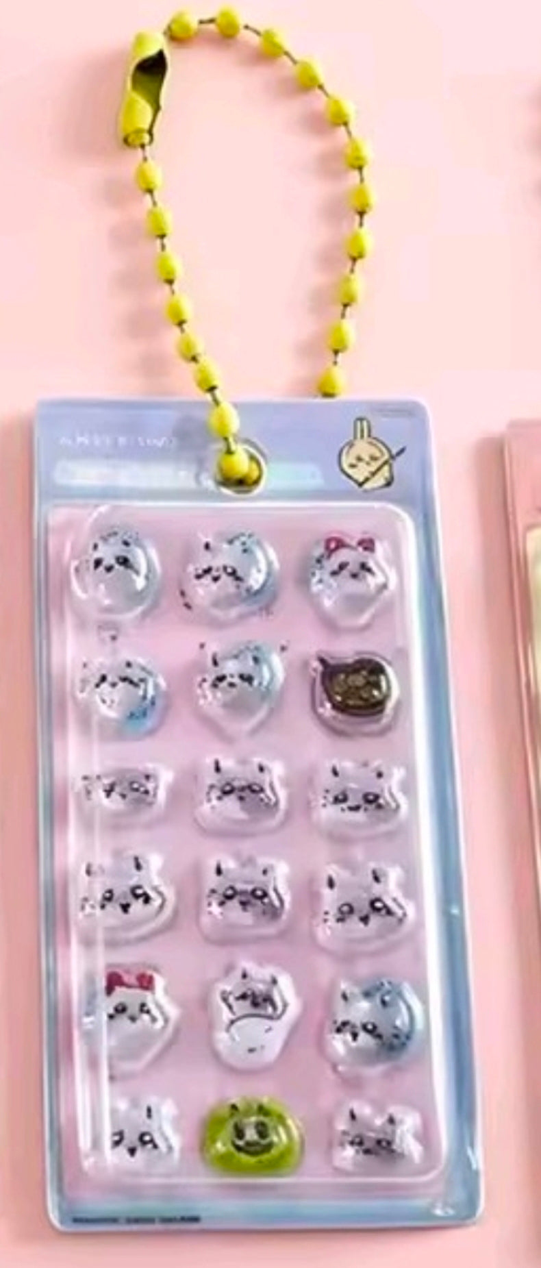 Mini gashapon sticker keychain with 3D character stickers and yellow bead strap