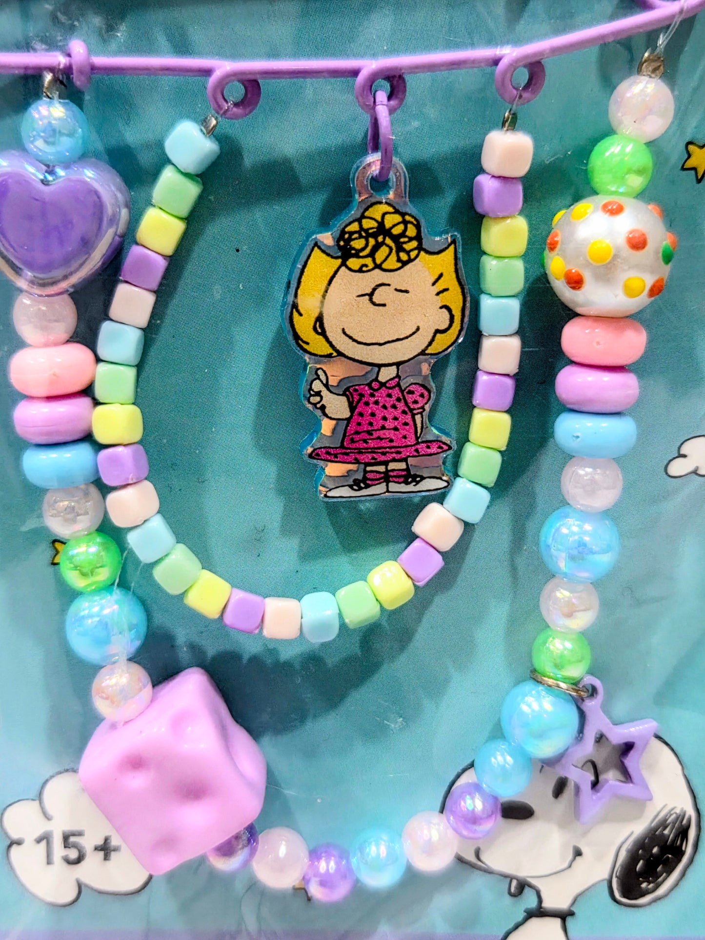 Peppermint Patty beaded safety pin keychain with multicolor beads, star charm, and heart tag