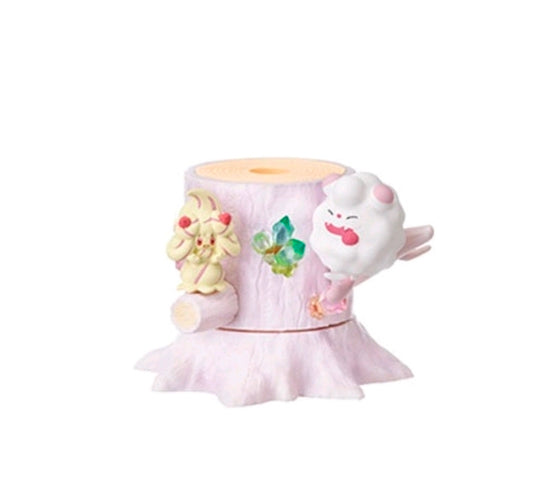 Mini figure diorama with light purple pedestal and two small characters: cream and white
