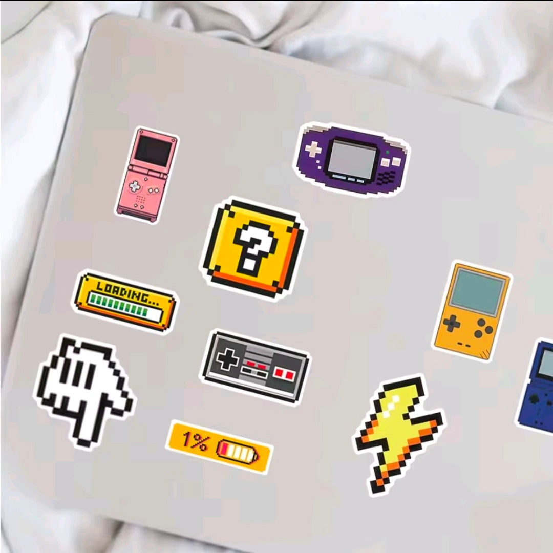 Nintendo sticker vinyl pack on fabric backdrop, showing handheld consoles and pixel characters