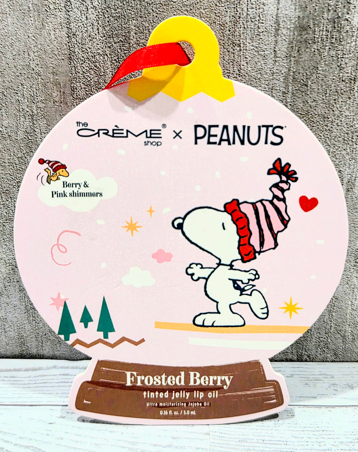 Tinted jelly lip oil box featuring Snoopy character and Frosted Berry tinted jelly label