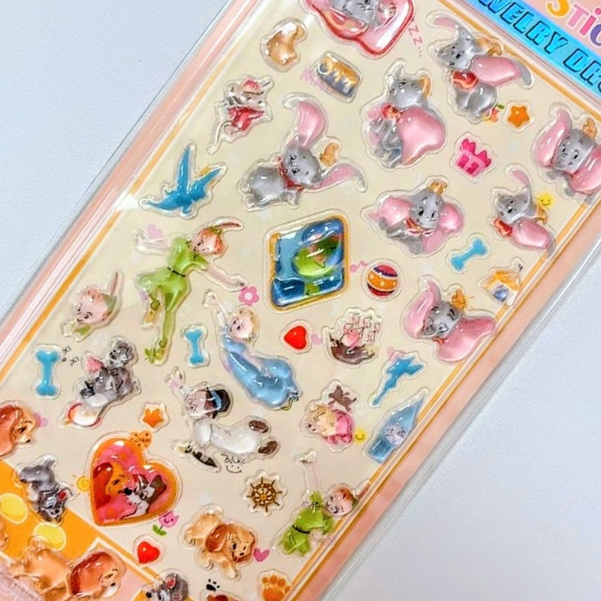 Close-up of Disney jewelry drop sticker sheet with small animal and heart charms