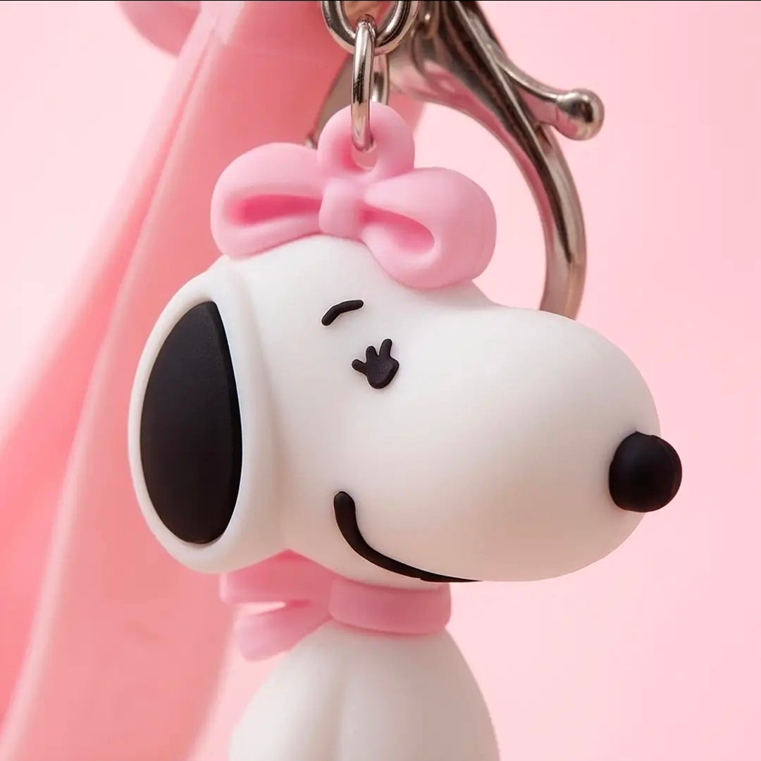 Snoopy keychain charm with pink bow on a metal ring