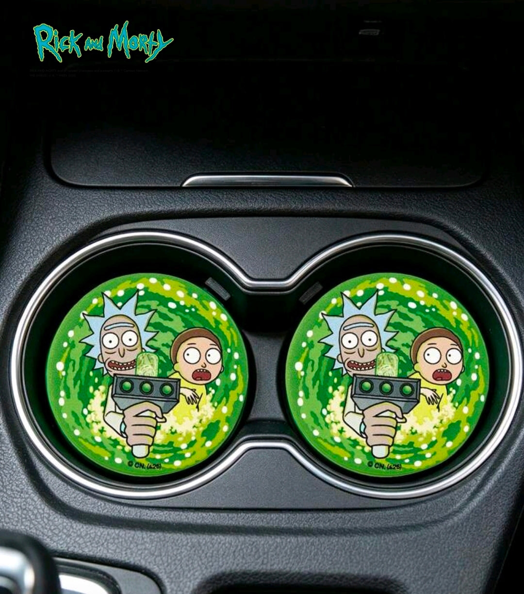 Pair of green round coasters with Rick & Morty portal art in car cup holder