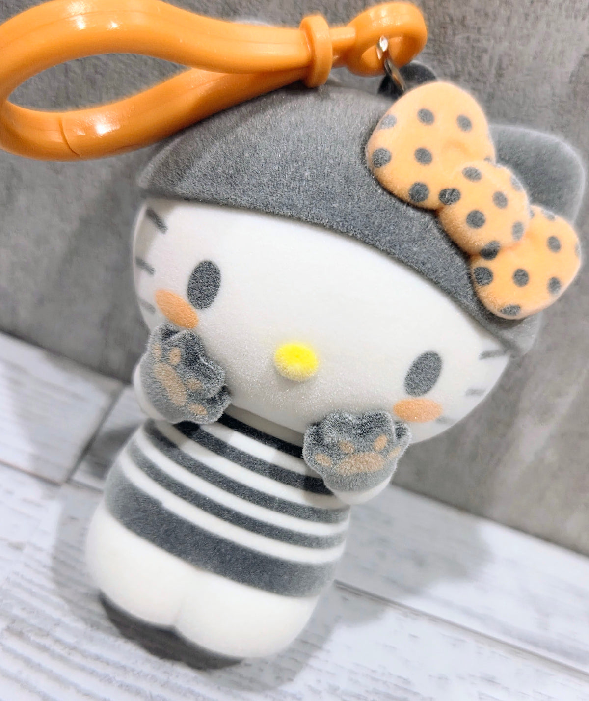 Grey striped cat bag clip/hanger with orange loop and cute face accents