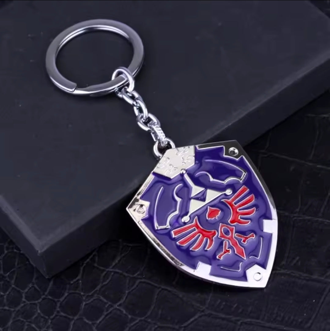 Blue shield enamel keychain with silver chain and split ring, red Triforce emblem