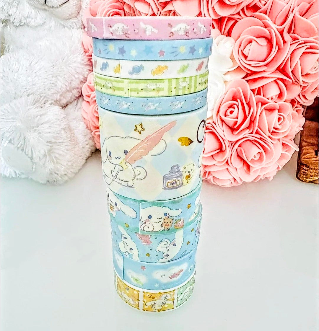 Stacked pastel Cinnamorol-style washi tape rolls with character illustrations