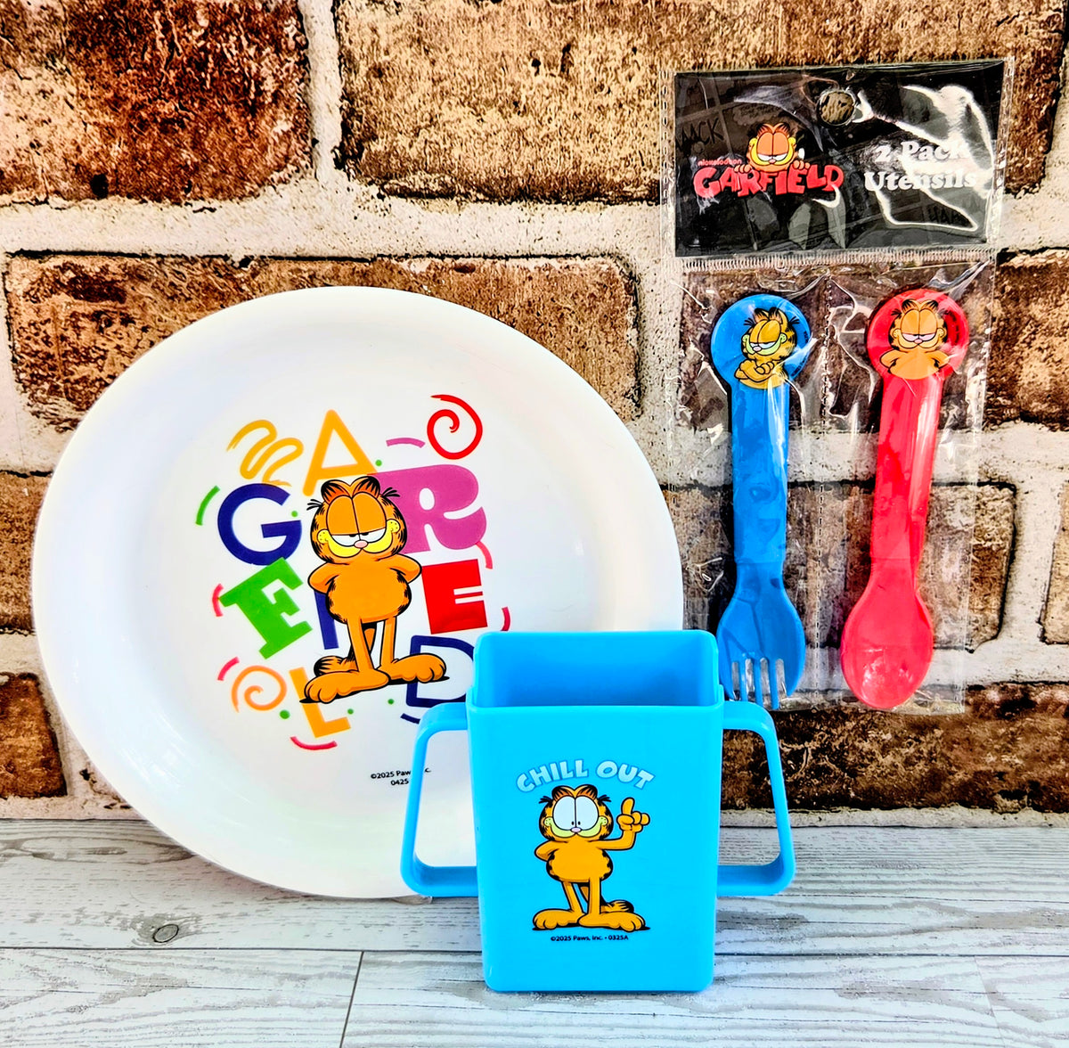 Garfield mealtime set with blue juice box holder, plate, and 2 packaged utensils